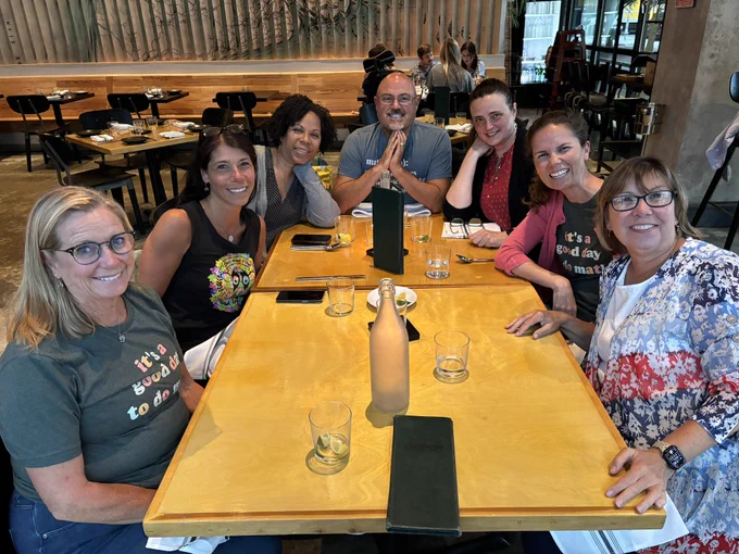 A group of conference attendees having dinner.