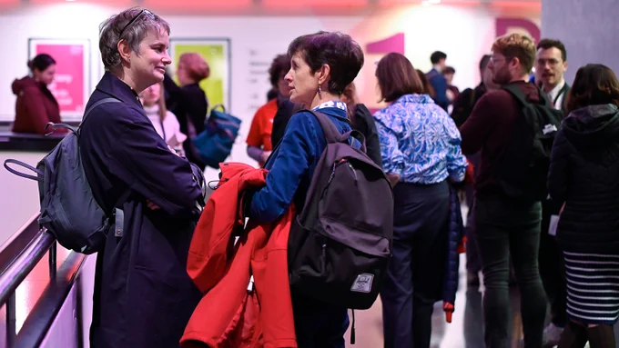 People talk and socialise in a conference space