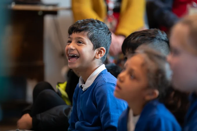 A group of school children enjoying a workshop in the Emporium of Stories.
