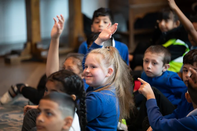 A group of school children enjoying a workshop in the Emporium of Stories.