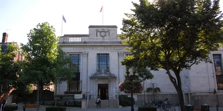 A picture of the front of Islington Town Hall with two trees in leaf