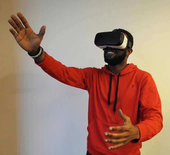 Image of a person wearing a virtual reality headset. Photo by Hammer & Tusk on Unsplash.