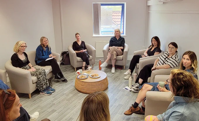 Circle of chairs with Sian Berry and Elaine Hills and the team from the charity BrightPIP talking together.
