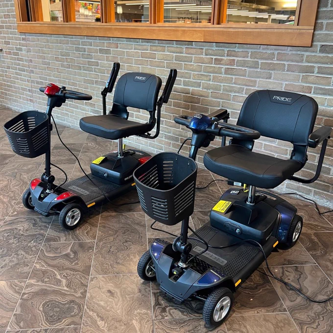 two mobility scooters