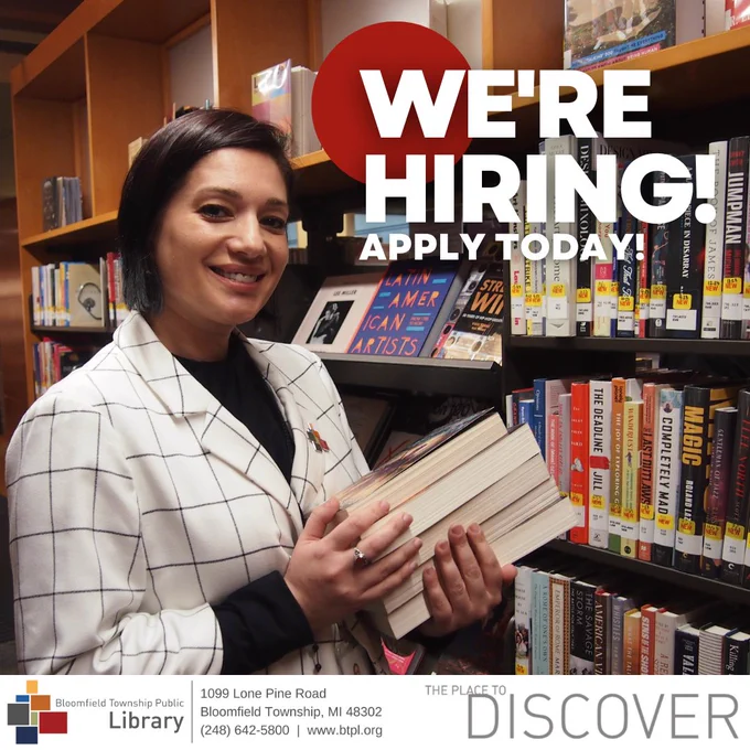 women in library stacks