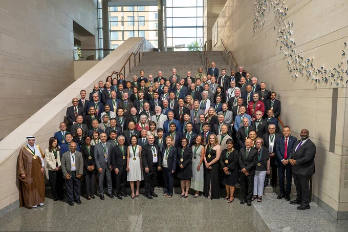 The most recent class of Fellows stands together after the N. A. I. 2024 Fellows Induction Ceremony at the National Academy of Inventors' 13th Annual Conference.