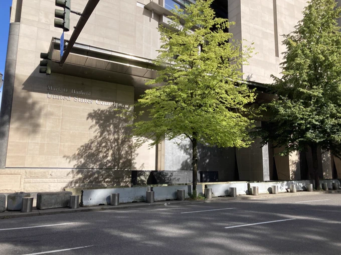 Portland federal courthouse with steel barriers on the front of the building