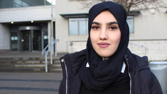 Image of young woman wearing a head scarf. 
