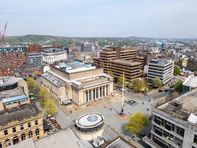 A drone shot of Sheffield city centre, including Sheffield City Hall in Barkers Pool