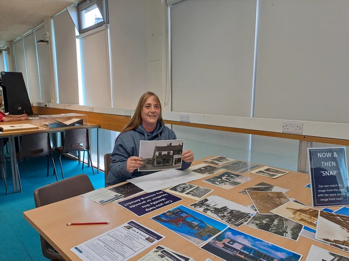 Colour photograph of Michelle with the photograph 