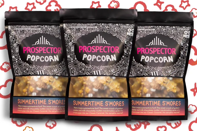 Three bags of Summertime S'mores stand in front of hand drawn stars and popcorn.
