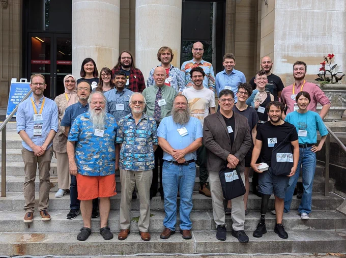 Presenters for the Grande Symposium at the North American Paleontological Convention standing on steps.