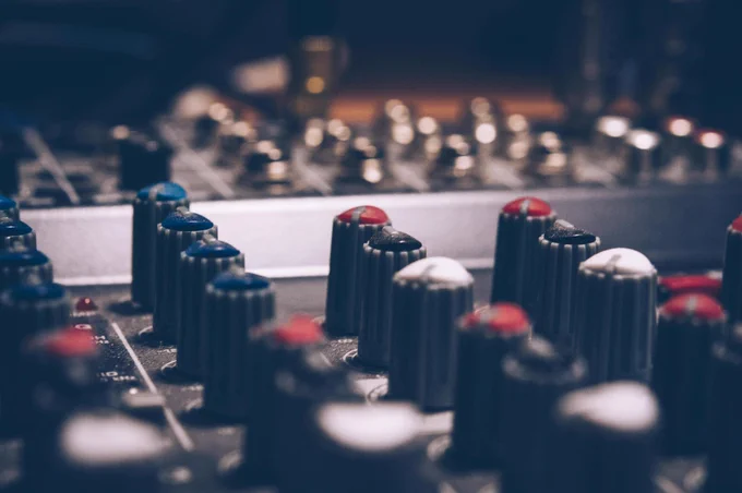 Close up of knobs on mixing desk