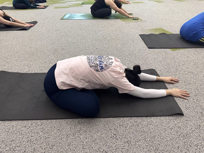 Person stretching in yoga class