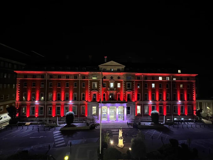 Large Hospital Building adirned with red lighting to celebrate World Sickle Cell Day