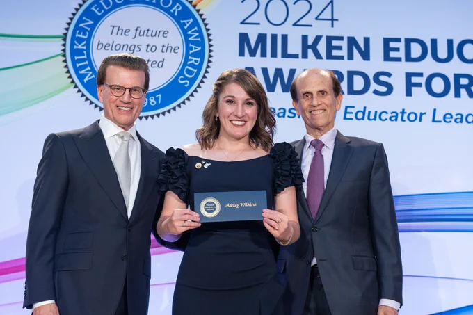 Pictured is 2023 West Virginia Milken Educator Ashley Wilkins posing for a photo with Lowell Milken, Milken Educator Awards founder and Milken Family Foundation chairman and co-founder, and Mike Milken, president and co-founder of the Milken Family Foundation.