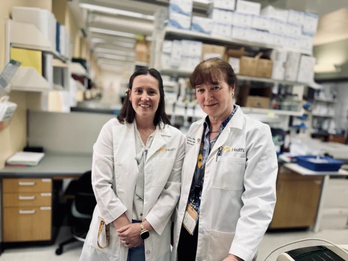 Postdoctoral fellow Maggie Freeberg, Ph.D. and Patricia Sime, M.D., chair of the Department of Internal Medicine at the School of Medicine, in their lab this spring. 