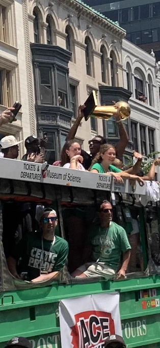 Paul Pierce holds up the 2008 championship trophy while on a duck boat in the Boston Celtics victory parade