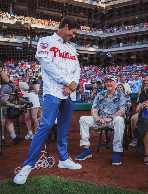 Cole Hamels shares a laugh with Charlie Manuel