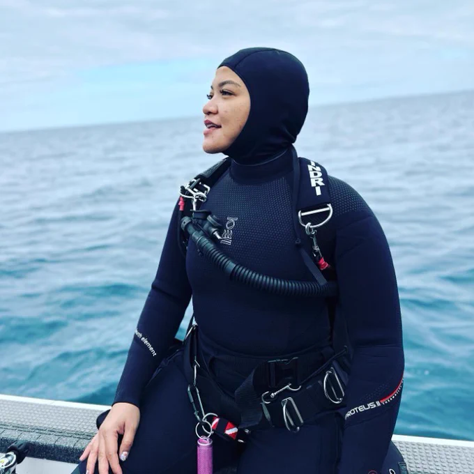 Diver on a boat, waiting to dive