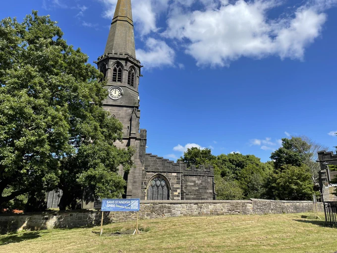 Photo taken in Standish towards St Wilfred’s church with its clock and spire