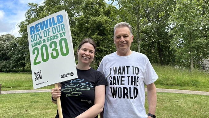 Hetti Riding from Rewilding Britian with Chris Packham and banner saying ‘Rewild 30% of our land & seas by 2030’