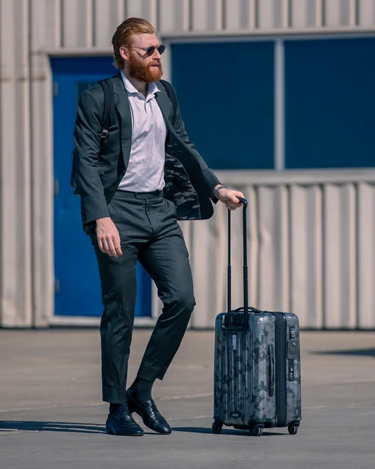 Connor Brown walking to the plane in Edmonton. 