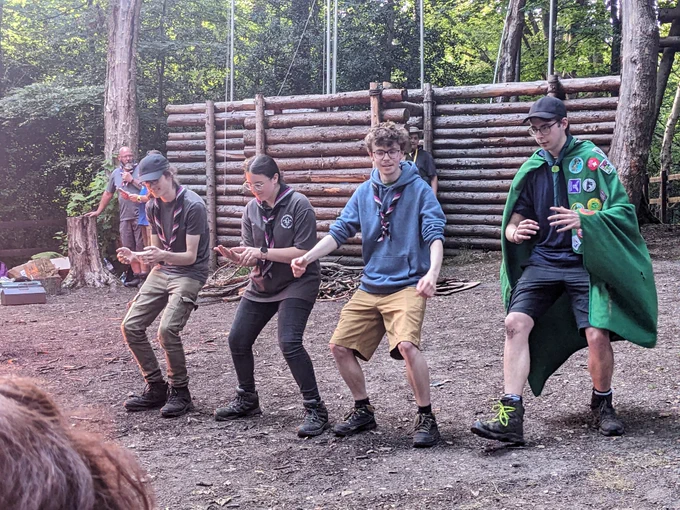 Explorer Scouts sitting on an invisible bench