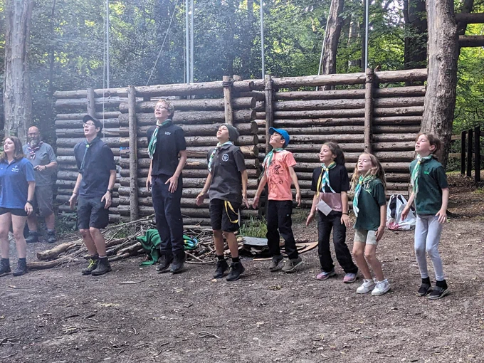 Scouts jumping as part of a song