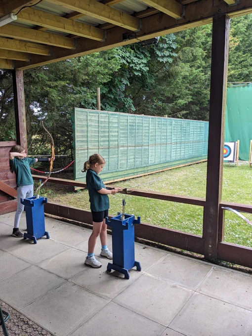 Cub Scouts doing archery 