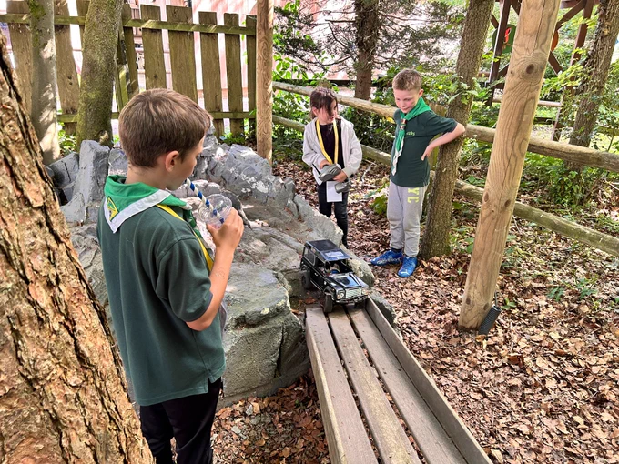 Cub Scouts controlling a remote control car