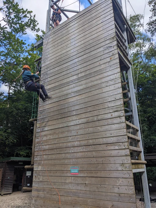 A Scout abseiling down a wall