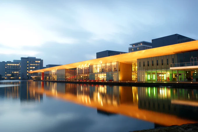 A wide shot of the High Tech Campus Eindhoven with moody lighting in the near-evening.