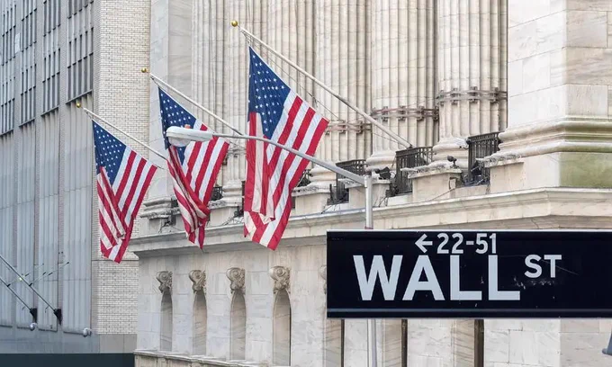 American flags hang from the facade of the New York Stock Exchange on Wall Street.