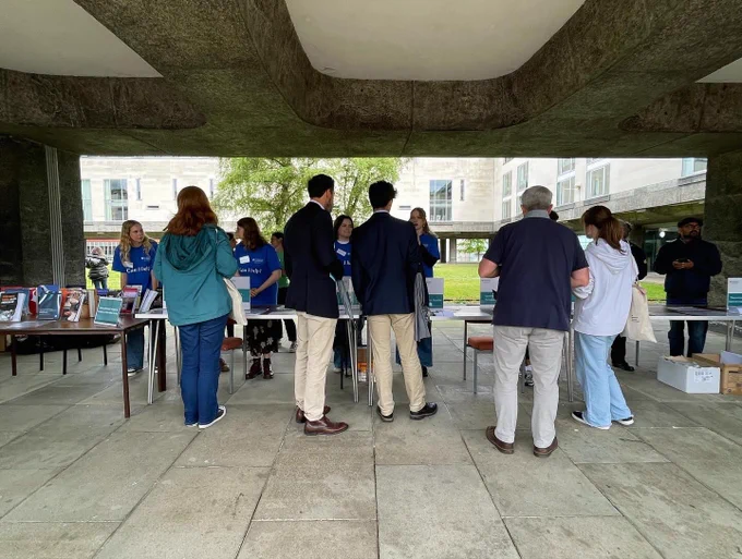 Parents and prospective students talk to current students and staff
