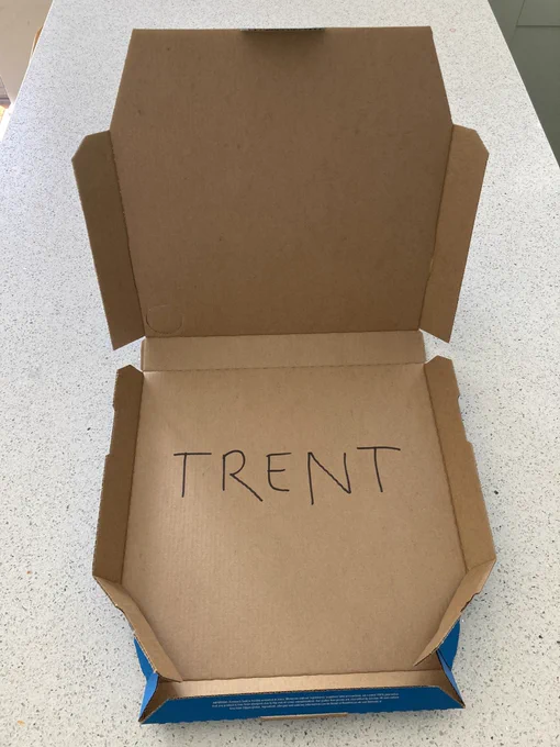 Pizza box with Trent written inside