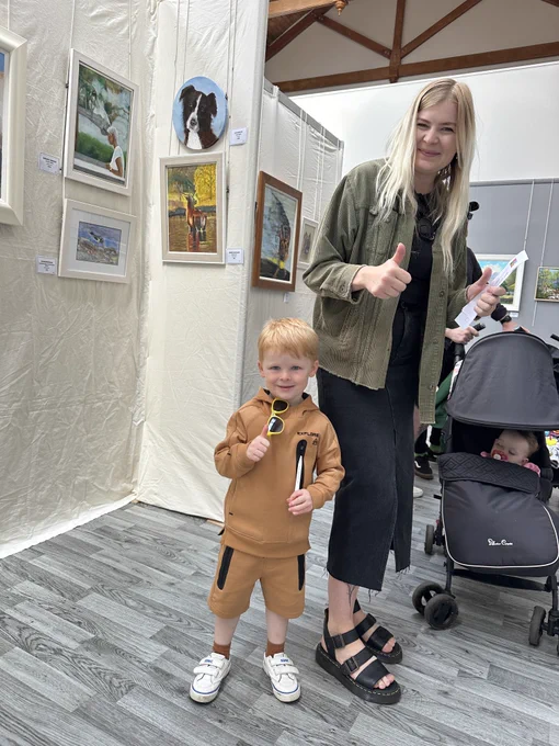 Child thumbs up for art exhibition - the North Ayrshire Open Art Exhibition is open daily 10am until 4pm until Saturday 20 July at The Racquet Hall, Eglinton Country Park