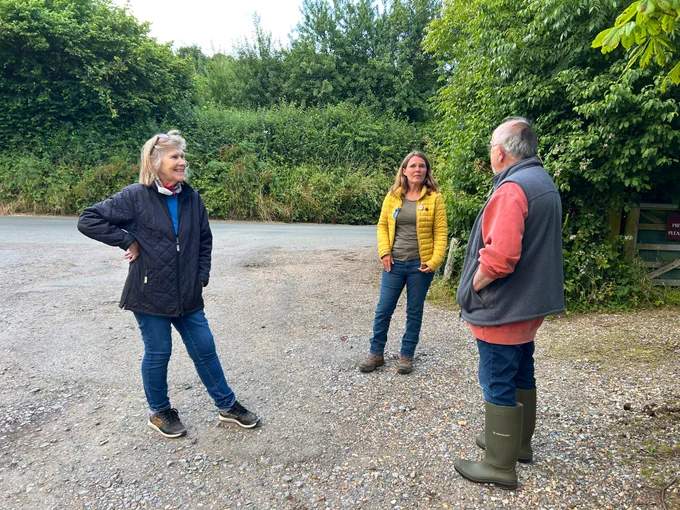 Vikki talking to local residents