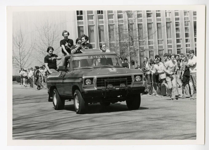"A 1970s model Ford F-100 truck drives down Frew Street as spectators watch from the sideline. Hunt Library can be seen in the background." (c.1975) Image from the University Archives, available online in our Digital Collections.