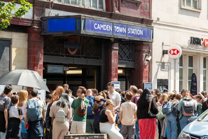 Crowds of people outside the exit of Camden Town Underground station.
