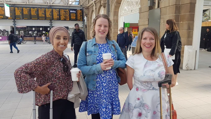 Photograph of Abtisam Mohamed, Olivia Blake, and Marie Tidball, in Sheffield railway station.