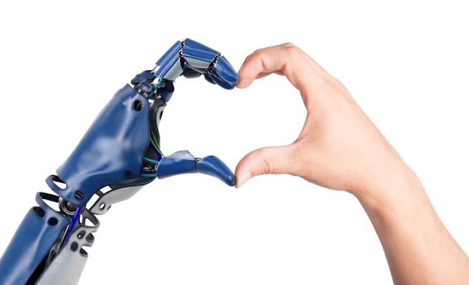 One AI hand and one human hand coming together to make a heart shape