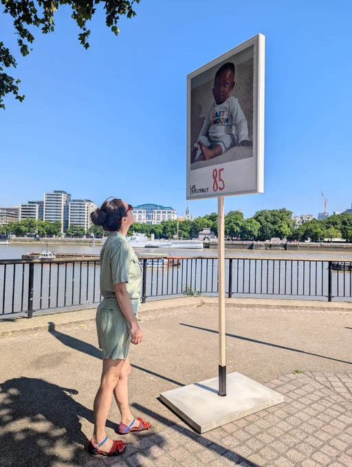 Director of Clean Air at Global Action Plan, Larissa Lockwood, looking at one of the placards