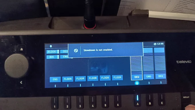 Televic interpreter console. Message on display: "Slowdown is not enabled."