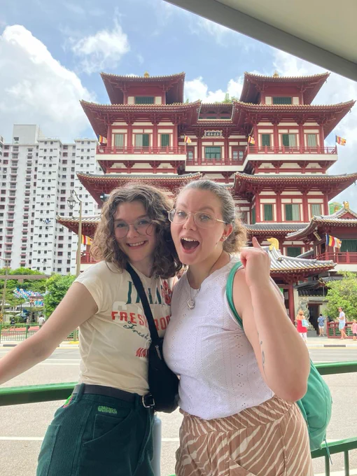 Huskers smile for a photo in front of a landmark while studying in Singapore