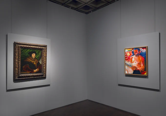 Gallery view of a portrait of a man on one wall and a contemporary portrait on the adjacent wall