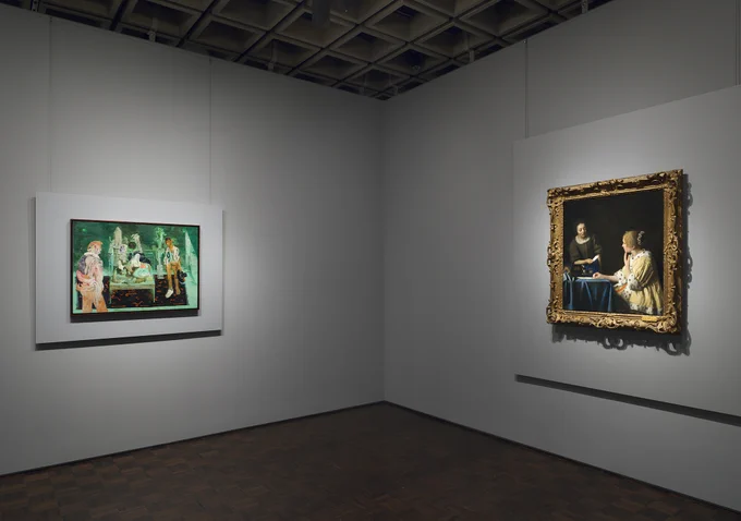 Gallery view of a contemporary painting on one wall and a painting of two women on the adjacent wall