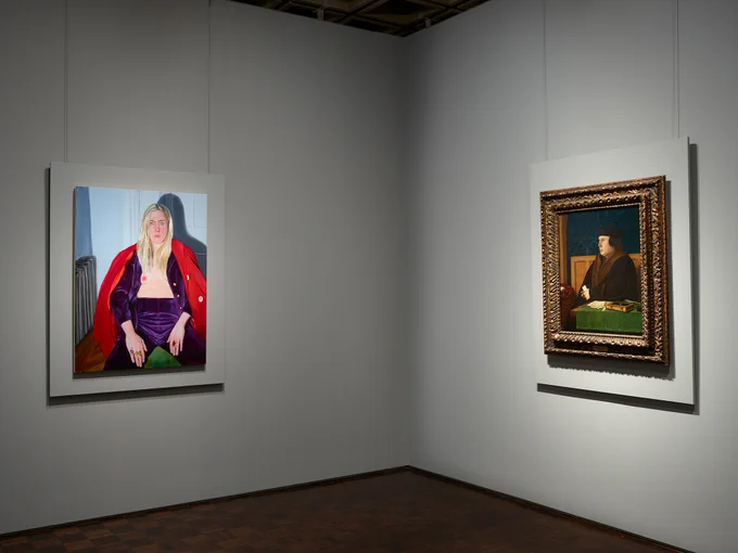 Gallery view of a contemporary portrait on one wall and a portrait of a man in a fur coat on the adjacent wall