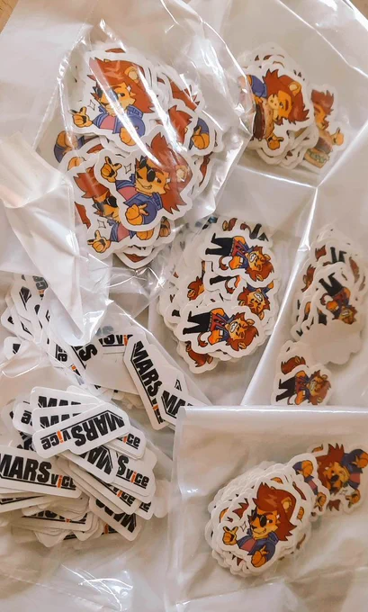 Multiple packs of stickers with different designs featuring Dax