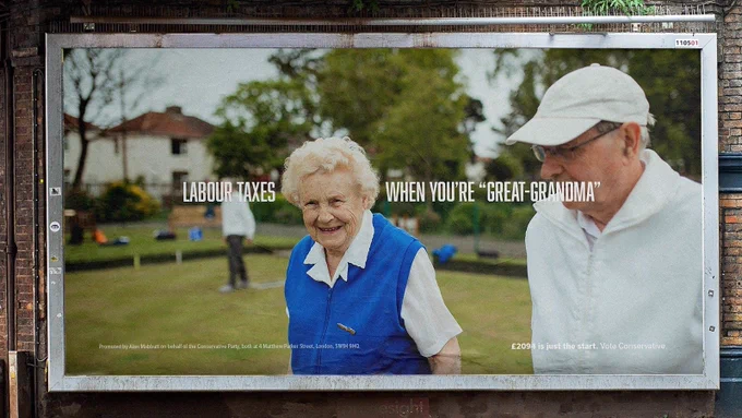 Indecipherable word salad on a (digitally mocked up) Conservative Party billboard. Text reads "Labour taxes [picture of an elderly woman] when you're "great grandma"". 